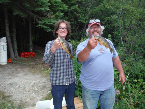 father and son small mouth bass catches