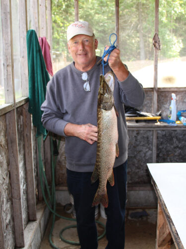 Gentleman Holding Northern Pike Catch