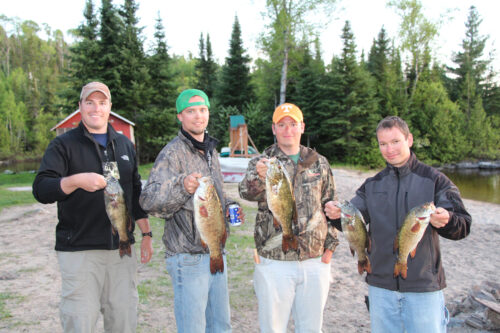 Group of Young Men with Days Bass Catches