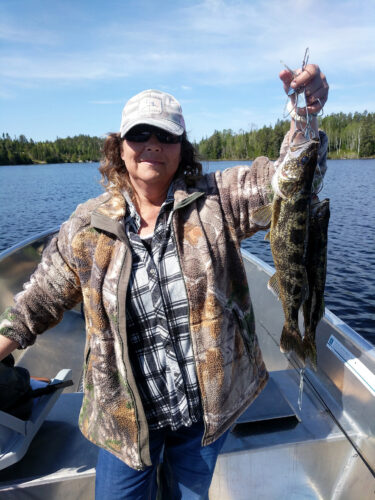 woman holding big walleye
